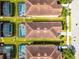 This aerial shows the backyard pool of the property, surrounded by other homes in a community at 8929 Sugar Palm Rd, Kissimmee, FL 34747