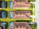 Aerial view of houses with screened-in pools and well-manicured lawns showing Florida living at 8929 Sugar Palm Rd, Kissimmee, FL 34747