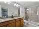 This bathroom features double sinks, and a glass-enclosed shower at 8929 Sugar Palm Rd, Kissimmee, FL 34747