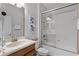 This bathroom features a shower and tub combination with a single sink vanity at 8929 Sugar Palm Rd, Kissimmee, FL 34747