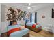 Bedroom featuring Marvel Comic themed wallpaper, and two twin beds at 8929 Sugar Palm Rd, Kissimmee, FL 34747