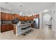 Spacious kitchen featuring an island with granite countertops, ample cabinet space, and stainless steel appliances at 8929 Sugar Palm Rd, Kissimmee, FL 34747