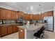 Beautiful kitchen with a spacious island, stainless steel appliances, granite countertops, and ample cabinet storage at 8929 Sugar Palm Rd, Kissimmee, FL 34747