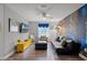 The living room has a distinctive mural, sleek furniture, and abundant natural light at 8929 Sugar Palm Rd, Kissimmee, FL 34747