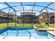 This screened-in pool and spa is perfect for outdoor enjoyment and relaxation with a spacious backyard at 8929 Sugar Palm Rd, Kissimmee, FL 34747