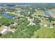A cozy home nestled among mature trees in a quiet neighborhood near green pastures and a beautiful pond at 930 Country Oaks Ln, Lakeland, FL 33810