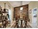 Dining room with natural light, a modern light fixture, and an accent wall at 930 Country Oaks Ln, Lakeland, FL 33810