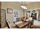 Traditional dining room with wood floors, rustic decor, and modern light fixture at 930 Country Oaks Ln, Lakeland, FL 33810