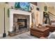 Stylish fireplace with stone surround, mantel, and cozy accents at 930 Country Oaks Ln, Lakeland, FL 33810