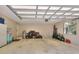 Spacious garage with storage, bright overhead lighting, and a window at 930 Country Oaks Ln, Lakeland, FL 33810