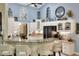Spacious kitchen with granite countertops, white cabinets, and a breakfast bar at 930 Country Oaks Ln, Lakeland, FL 33810