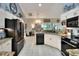 Open kitchen featuring modern appliances, granite countertops, and lots of counter space at 930 Country Oaks Ln, Lakeland, FL 33810