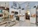 Beautiful kitchen featuring granite countertops, tile floors, and white cabinets at 930 Country Oaks Ln, Lakeland, FL 33810