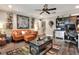 Comfortable living room with a decorative ceiling fan, and a unique decorative wall design at 930 Country Oaks Ln, Lakeland, FL 33810