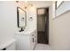 Bathroom featuring a white vanity with black hardware and an open doorway at 108 Sandburg Ln, Winter Haven, FL 33884