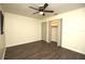 This bedroom offers wood-look flooring, ample closet space, and neutral wall color for a cozy retreat at 108 Sandburg Ln, Winter Haven, FL 33884