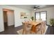 Bright dining room with modern decor, seating for six, and sliding glass doors leading to the pool area at 108 Sandburg Ln, Winter Haven, FL 33884