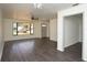 Bright living room with wood floors, a ceiling fan, and natural light from a large window at 108 Sandburg Ln, Winter Haven, FL 33884