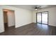 An airy living room features wood-look flooring and access to outdoor living via sliding glass doors at 108 Sandburg Ln, Winter Haven, FL 33884