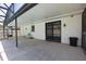 Covered patio with seating and a view of the pool area at 108 Sandburg Ln, Winter Haven, FL 33884