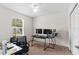 Bedroom featuring a ceiling fan, a work desk, and natural light from the window at 11 W Bay St, Davenport, FL 33837
