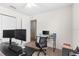 Cozy bedroom featuring neutral tones, carpeted floor, and work from home space at 11 W Bay St, Davenport, FL 33837