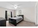 Inviting bedroom with a ceiling fan and a comfortable bed with stylish bedding at 11 W Bay St, Davenport, FL 33837