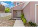 Inviting home front entrance features a covered porch and manicured landscaping at 11 W Bay St, Davenport, FL 33837