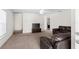 Spacious living room with neutral carpet, and a comfortable leather sofa set at 11 W Bay St, Davenport, FL 33837