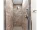 Walk-in shower with tile walls and floor and clear glass door, offering a modern aesthetic at 11 W Bay St, Davenport, FL 33837