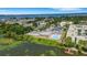 Aerial view highlighting the community's amenities, including a pool, tennis courts, and lake access at 1130 N Lake Parker Ave # C321, Lakeland, FL 33805