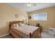 Comfortable bedroom featuring a ceiling fan and a bright window at 1130 N Lake Parker Ave # C321, Lakeland, FL 33805