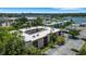 Exterior view featuring an apartment building with a well-kept parking lot, and landscaping at 1130 N Lake Parker Ave # C321, Lakeland, FL 33805
