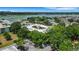 Exterior view showing the building's layout, parking, and surrounding lush greenery at 1130 N Lake Parker Ave # C321, Lakeland, FL 33805