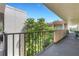 Balcony hallway with trees and decorative railings at 1130 N Lake Parker Ave # C321, Lakeland, FL 33805