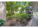 Hallway surrounded by bushes and manicured landscaping at 1130 N Lake Parker Ave # C321, Lakeland, FL 33805