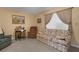 A cozy living room with floral sofa, recliner, and natural lighting at 1130 N Lake Parker Ave # C321, Lakeland, FL 33805