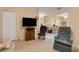 Inviting living room open to dining area, featuring neutral walls and comfortable seating at 1130 N Lake Parker Ave # C321, Lakeland, FL 33805
