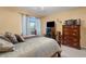 Inviting main bedroom featuring a ceiling fan, balcony, and stylish furnishings at 1130 N Lake Parker Ave # C321, Lakeland, FL 33805