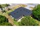 Aerial view of home showing the roof, backyard, and surrounding landscaping and neighborhood at 1195 E George St, Bartow, FL 33830