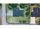 Aerial view of the property showcasing the landscaping, driveway, and surrounding neighborhood at 1195 E George St, Bartow, FL 33830
