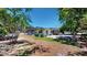 Backyard view of the home showing the patio, landscaping, and outdoor space for entertaining at 1195 E George St, Bartow, FL 33830