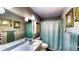 Full bathroom features a shower/tub combo with a decorative shower curtain at 1195 E George St, Bartow, FL 33830