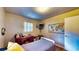 A bedroom with hardwood floors, map decoration, and a view of the doorway at 1195 E George St, Bartow, FL 33830