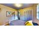 A bedroom with hardwood floors, a map decoration, and double closet at 1195 E George St, Bartow, FL 33830