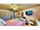 This bedroom features a ceiling fan and closet at 1195 E George St, Bartow, FL 33830