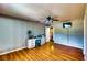 Spacious bedroom featuring hardwood floors, a ceiling fan, and natural light from the window at 1195 E George St, Bartow, FL 33830