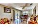 Bright dining area with sliding glass doors to the backyard, adjacent to a cozy living space at 1195 E George St, Bartow, FL 33830