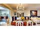 Elegant dining room featuring a classic chandelier, china cabinet and stylish decor at 1195 E George St, Bartow, FL 33830