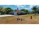 Front exterior showcasing the home's facade, lawn, and American flag, reflecting pride of ownership at 1195 E George St, Bartow, FL 33830